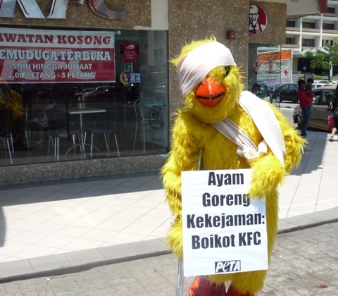 PETA Rocks KFC Malaysia With Grim Reapers, Caged Activists, and a Crippled Chicken