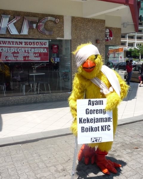 PETA Rocks KFC Malaysia With Grim Reapers, Caged Activists, and a Crippled Chicken
