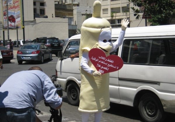 Prancing Condoms Teach Pedestrians Their ABCs; Activists Protesting KFC Arrested in Syria