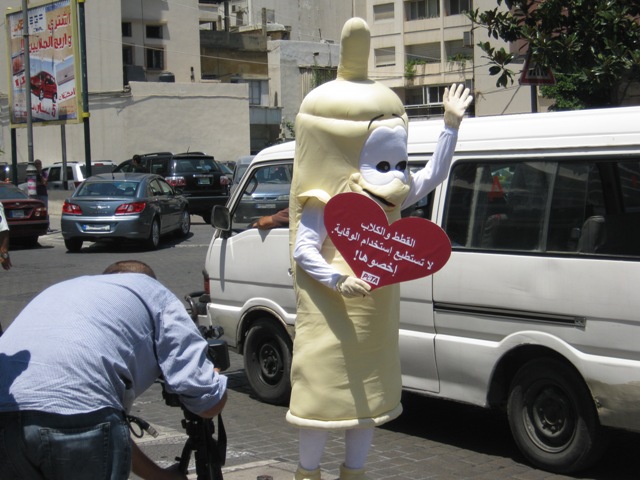 Prancing Condoms Teach Pedestrians Their ABCs; Activists Protesting KFC Arrested in Syria