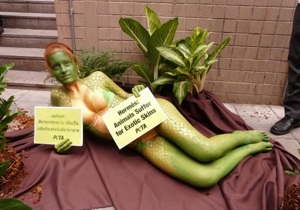 A Slithery Protest: Naked Activist Asks Hermès to Leave Snakes in the Jungle!