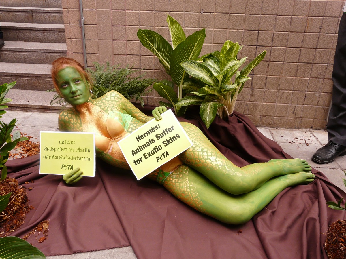 A Slithery Protest: Naked Activist Asks Hermès to Leave Snakes in the Jungle!