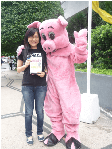 Wenjin hands out leaflets on the streets of Makati in the Philippines.