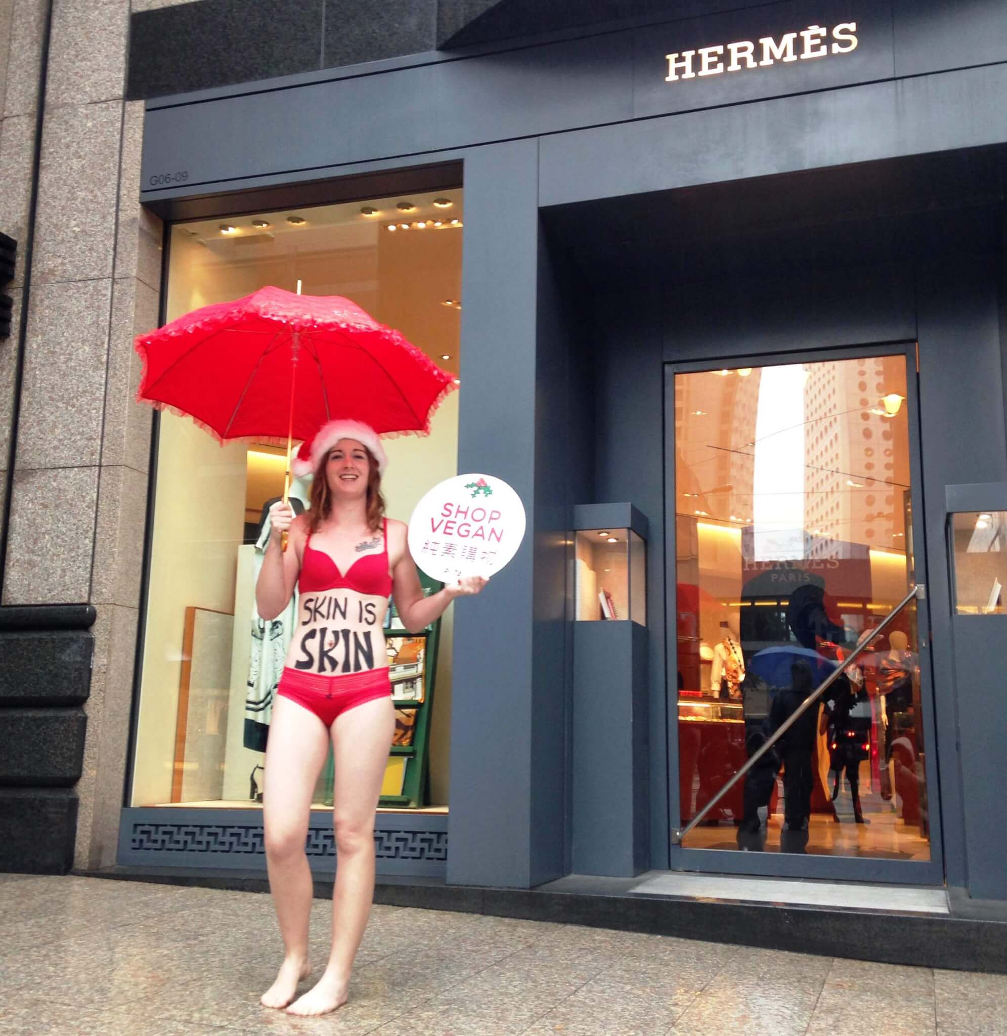 Activist in Sexy Ho-ho-holiday Outfit with “Skin is Skin” Message