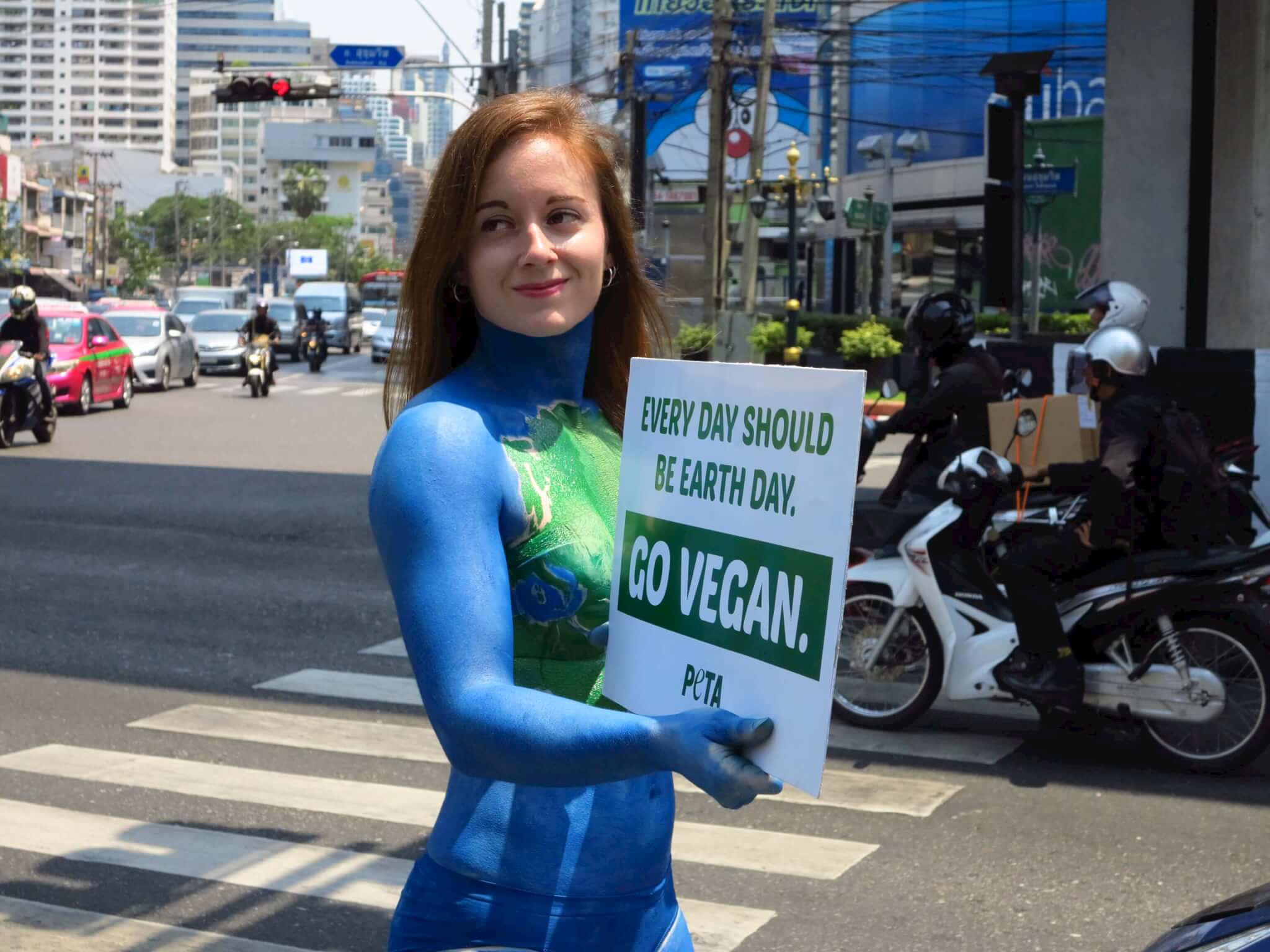 PHOTOS: Activist Bodypainted as ‘Mother Earth’ in Bangkok for Earth Day